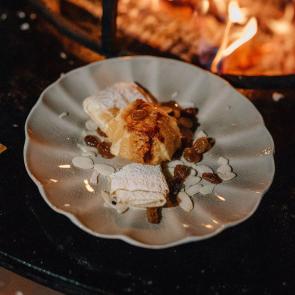 Flambéed orange on caramelized almonds